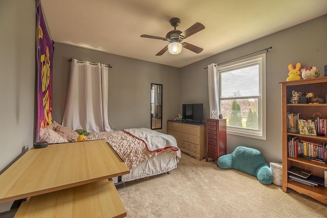 carpeted bedroom featuring a ceiling fan
