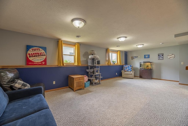 game room with baseboards, carpet, and a textured ceiling