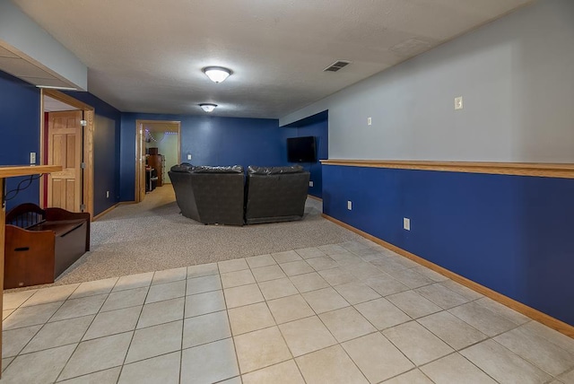 unfurnished living room featuring carpet floors and visible vents