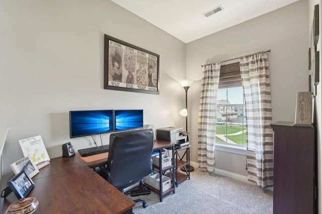 carpeted home office featuring baseboards and visible vents