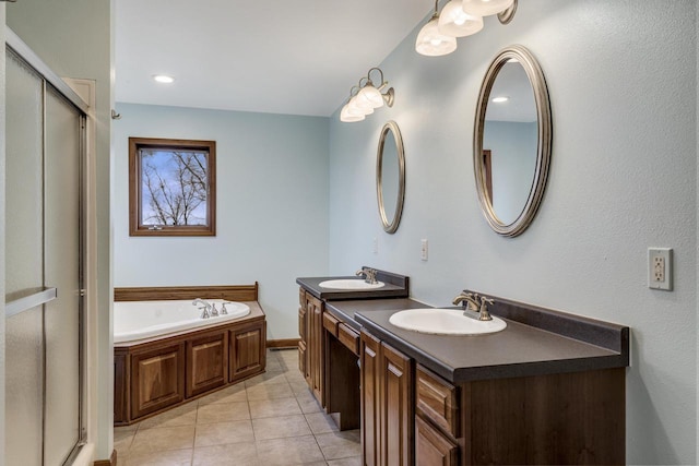 full bath featuring a stall shower, tile patterned flooring, a sink, and double vanity