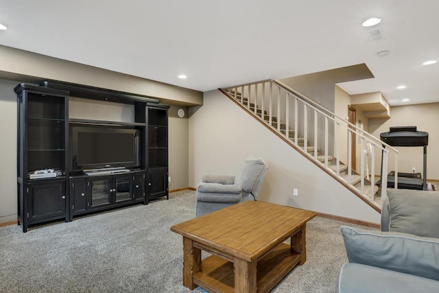 carpeted living area with recessed lighting, stairway, and baseboards