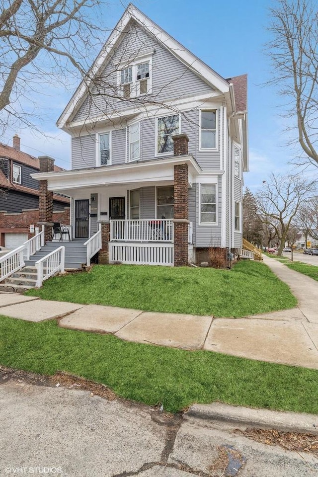 2968 N Buffum St Unit 2968A, Milwaukee, WI 53212 - traditional style home featuring a porch and a front lawn