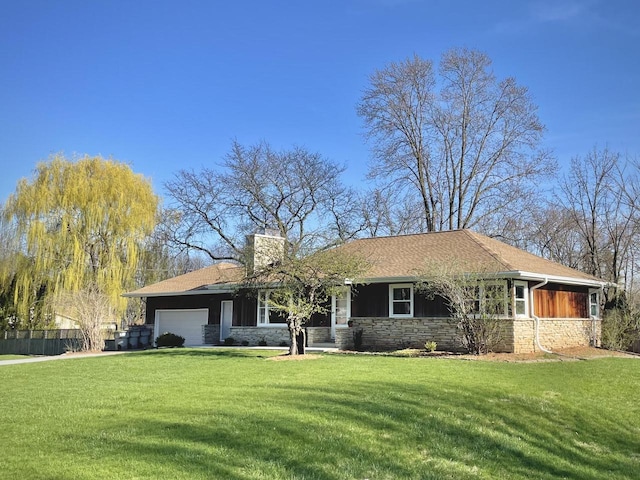 single story home featuring an attached garage, a chimney, stone siding, and a front lawn