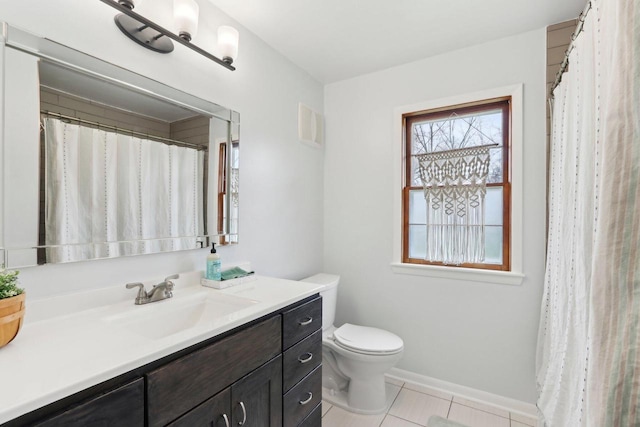 full bath featuring a shower with curtain, tile patterned flooring, vanity, baseboards, and toilet