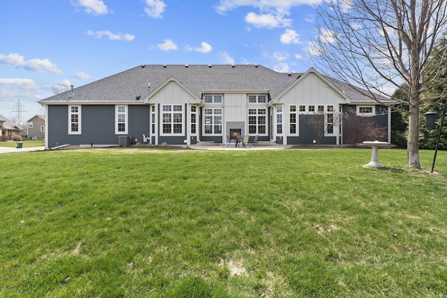 back of property featuring central air condition unit, a patio, board and batten siding, and a yard