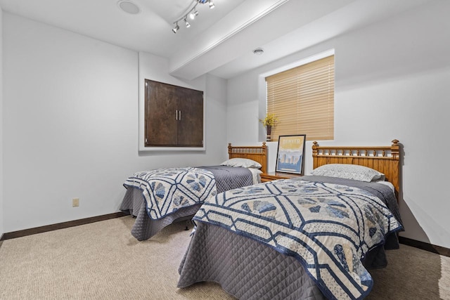 bedroom featuring baseboards and carpet flooring