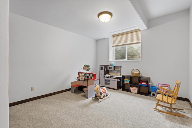 rec room featuring baseboards and carpet