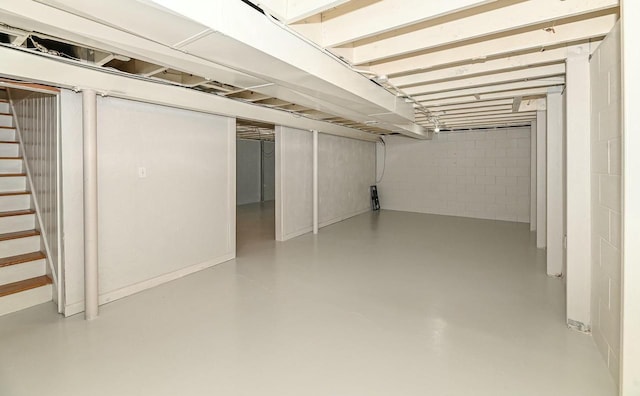 finished below grade area featuring stairway