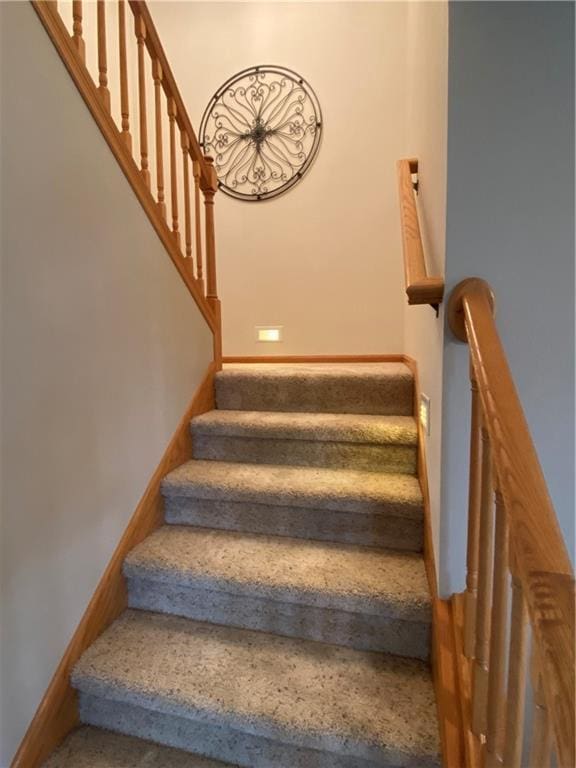 stairway featuring baseboards