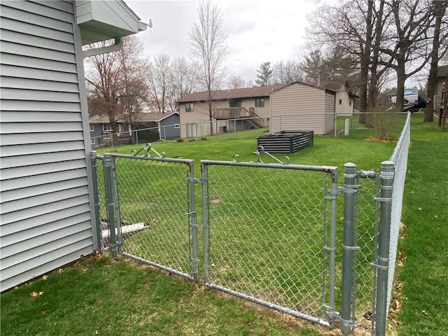 view of yard featuring fence and a gate
