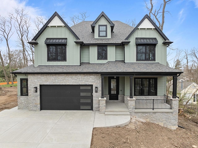 N1931 Linn Rd, Lake Geneva, WI 53147 - modern inspired farmhouse featuring covered porch, board and batten siding, concrete driveway, and stone siding