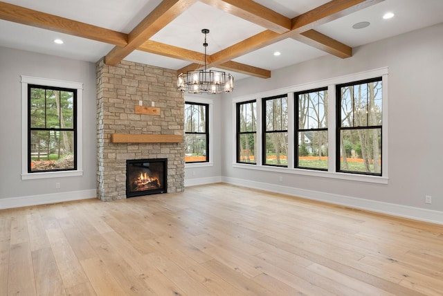 N1931 Linn Rd, Lake Geneva, WI 53147 - unfurnished living room with a healthy amount of sunlight, baseboards, and light wood finished floors
