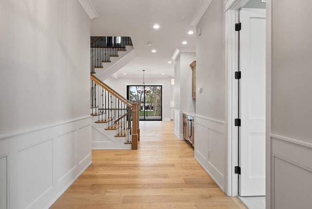 N1931 Linn Rd, Lake Geneva, WI 53147 - hallway featuring crown molding, recessed lighting, light wood-type flooring, and stairs