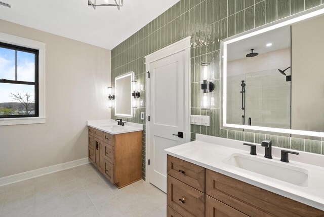 N1931 Linn Rd, Lake Geneva, WI 53147 - bathroom with vanity, baseboards, a tile shower, and tile patterned floors