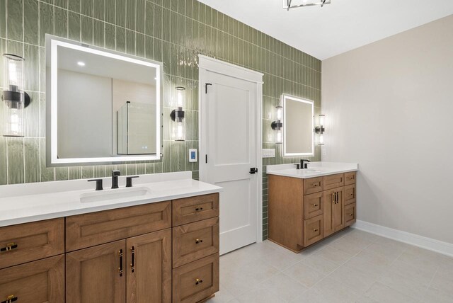 N1931 Linn Rd, Lake Geneva, WI 53147 - full bath with tile patterned flooring, a sink, baseboards, and two vanities