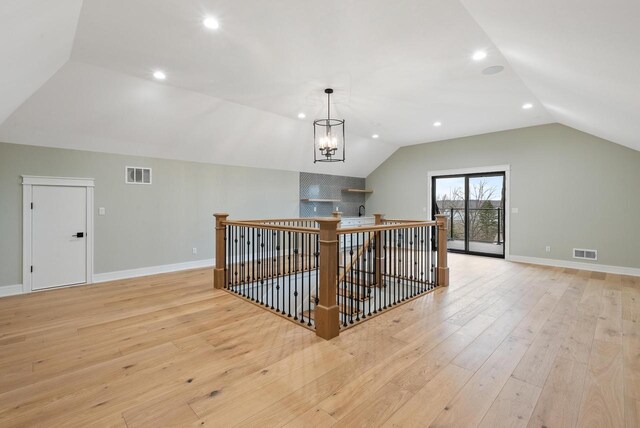 N1931 Linn Rd, Lake Geneva, WI 53147 - additional living space with visible vents, recessed lighting, lofted ceiling, and light wood-type flooring