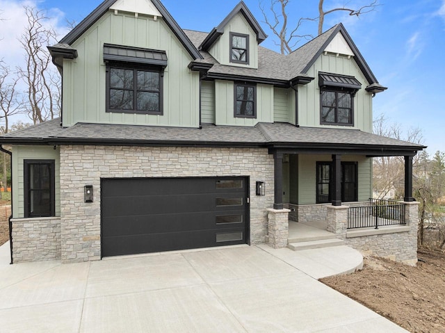 N1931 Linn Rd, Lake Geneva, WI 53147 - view of front of home featuring board and batten siding, covered porch, and stone siding