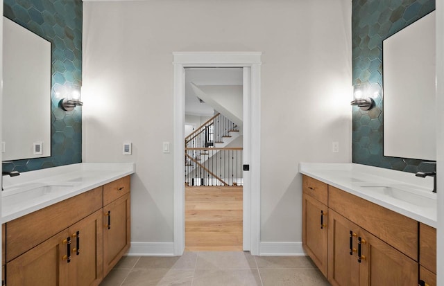 N1931 Linn Rd, Lake Geneva, WI 53147 - bathroom featuring a sink, baseboards, and two vanities