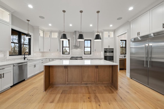N1931 Linn Rd, Lake Geneva, WI 53147 - kitchen featuring a sink, appliances with stainless steel finishes, a center island, and light countertops