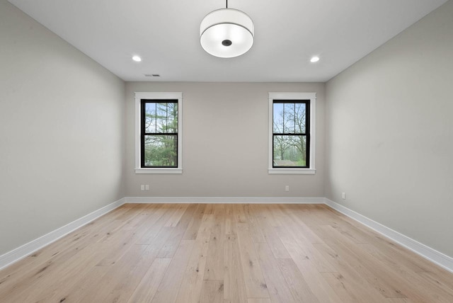 N1931 Linn Rd, Lake Geneva, WI 53147 - spare room featuring baseboards, visible vents, a healthy amount of sunlight, and light wood-type flooring