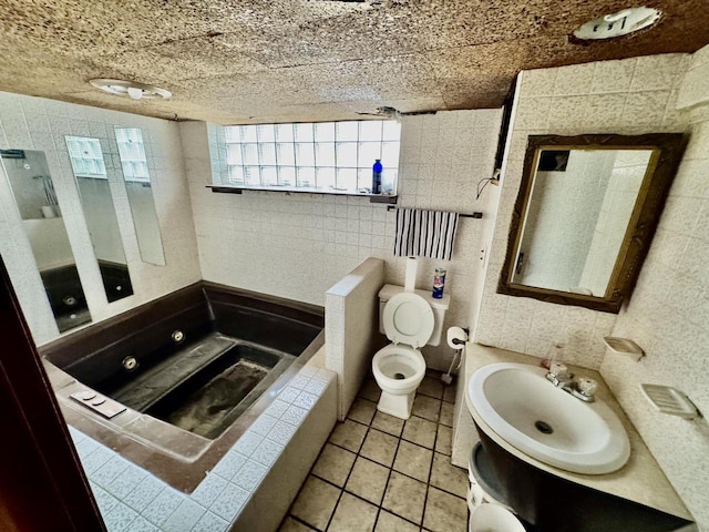 full bathroom featuring toilet, tile patterned flooring, and vanity