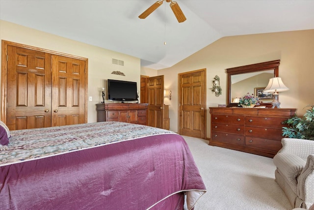 bedroom featuring visible vents, ceiling fan, light colored carpet, and vaulted ceiling