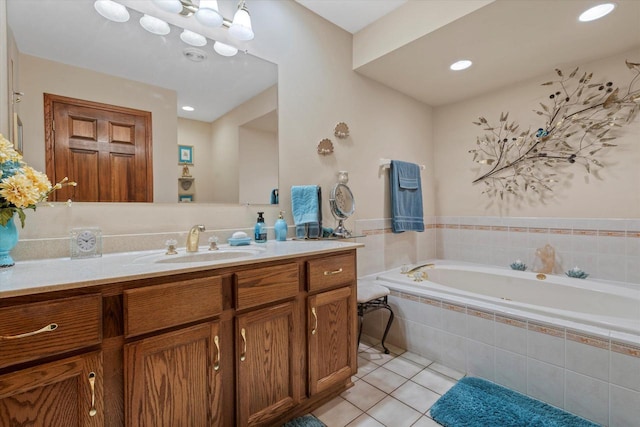 bathroom featuring recessed lighting, a garden tub, tile patterned flooring, and vanity