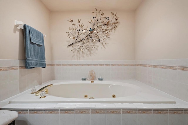 full bathroom with a tub with jets