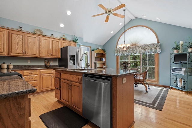 kitchen with a ceiling fan, a healthy amount of sunlight, appliances with stainless steel finishes, and a sink