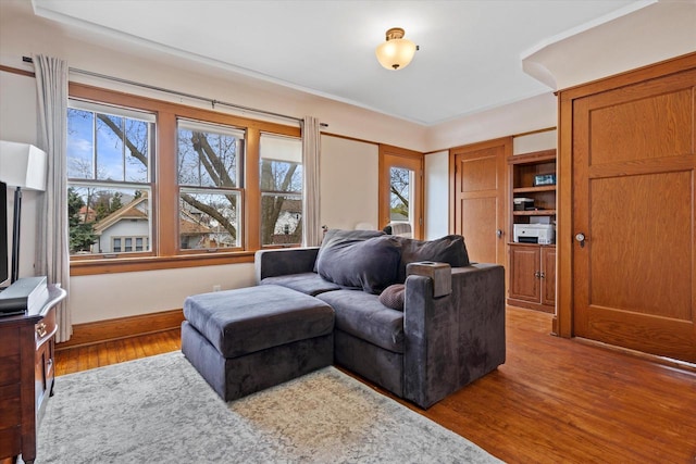 living room with wood finished floors and baseboards