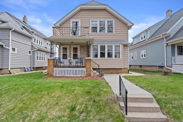 view of front of home with a front lawn, a porch, and a balcony