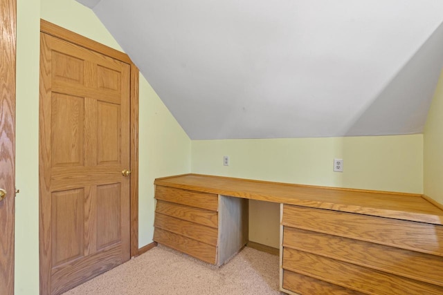 3559 N Shore Dr, Hubertus, WI 53033 - unfurnished office featuring vaulted ceiling, light colored carpet, baseboards, and built in study area