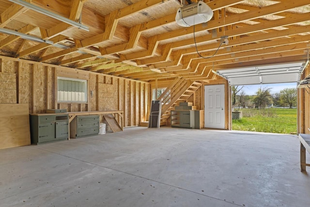 3559 N Shore Dr, Hubertus, WI 53033 - garage featuring a garage door opener