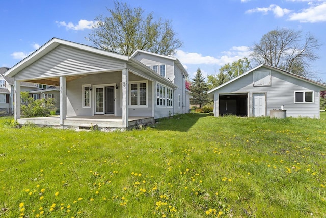 3559 N Shore Dr, Hubertus, WI 53033 - rear view of property with a yard and covered porch