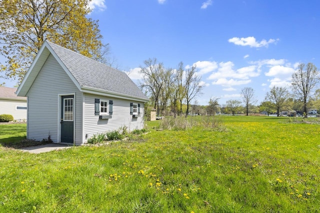 3559 N Shore Dr, Hubertus, WI 53033 - view of green lawn featuring an outbuilding and cooling unit