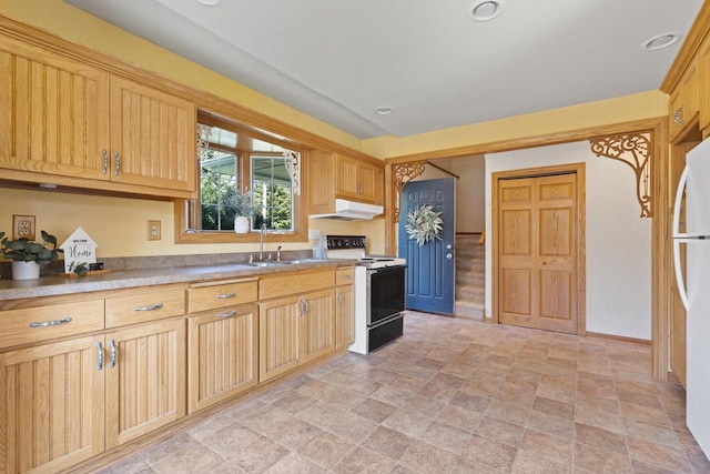 3559 N Shore Dr, Hubertus, WI 53033 - kitchen featuring range with electric cooktop, under cabinet range hood, a sink, stone finish flooring, and freestanding refrigerator
