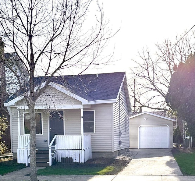 14 Wirth Ct, Madison, WI 53704 - view of front of house with a porch, an outbuilding, a garage, concrete driveway, and a shingled roof