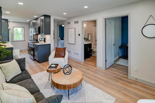 14 Wirth Ct, Madison, WI 53704 - living room featuring light wood-type flooring, recessed lighting, and baseboards