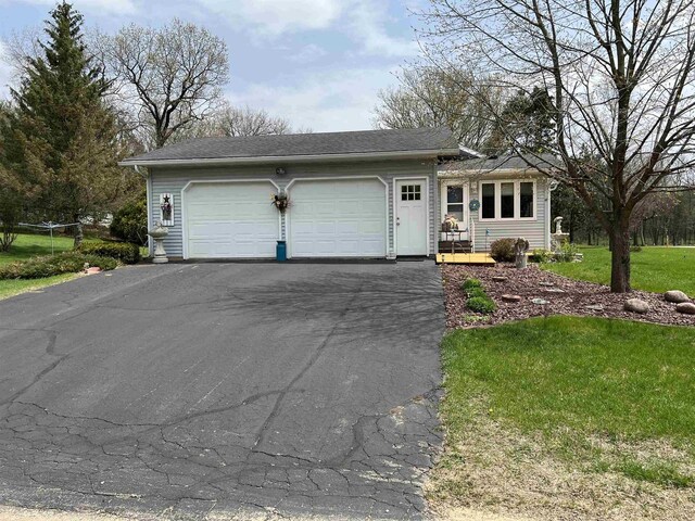 34103 Putnam St, Muscoda, WI 53573 - single story home with a garage, aphalt driveway, and a front yard