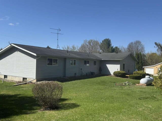 34103 Putnam St, Muscoda, WI 53573 - rear view of house featuring a lawn