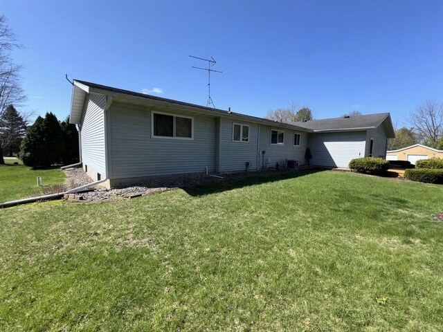 34103 Putnam St, Muscoda, WI 53573 - ranch-style home with cooling unit and a front lawn