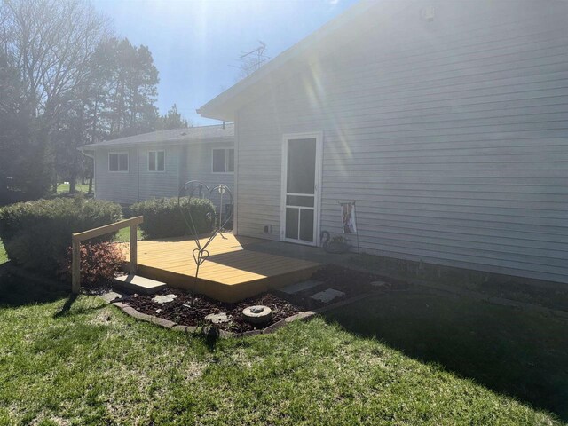34103 Putnam St, Muscoda, WI 53573 - back of house with a lawn and a wooden deck