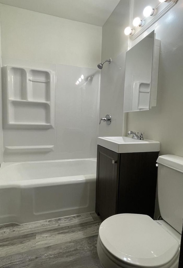 3367 N 36th St, Milwaukee, WI 53216 - bathroom with toilet, washtub / shower combination, wood finished floors, and vanity