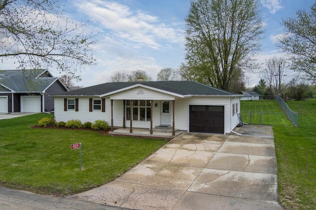 ranch-style home featuring a garage, a front lawn, fence, covered porch, and concrete driveway