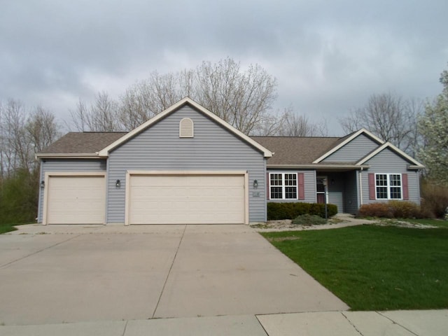ranch-style home featuring a garage, roof with shingles, concrete driveway, and a front lawn