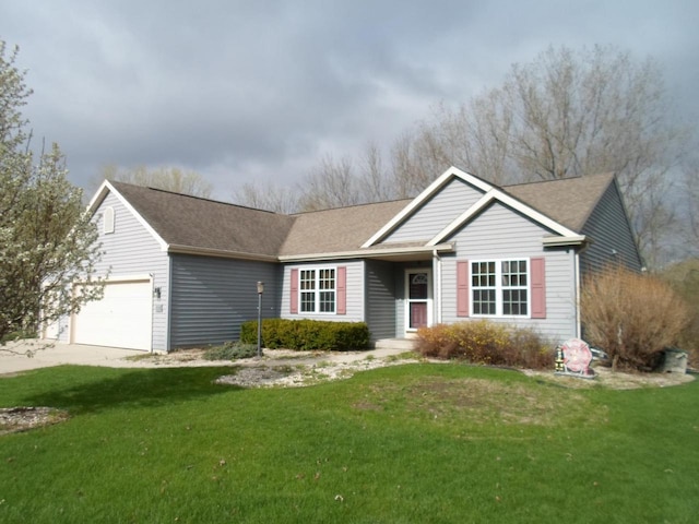 ranch-style home with an attached garage, driveway, and a front yard