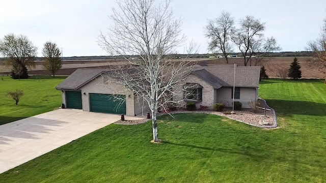 ranch-style house featuring a garage, driveway, and a front yard