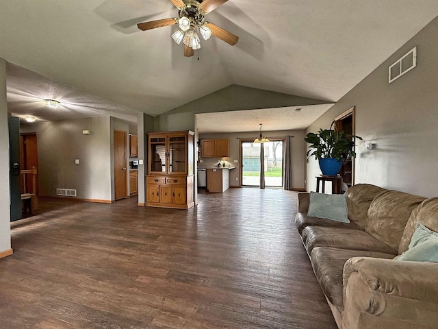 living area featuring dark wood-style flooring, ceiling fan, visible vents, and lofted ceiling