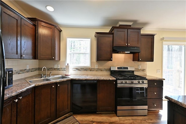 13585 Oswald Rd, Drummond, WI 54832 - kitchen with a sink, stainless steel gas range oven, black dishwasher, a healthy amount of sunlight, and under cabinet range hood